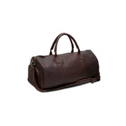 
Как выглядит на человеке:  Leather Garment Bag Finlay на модели — естественные складки при дневном свете